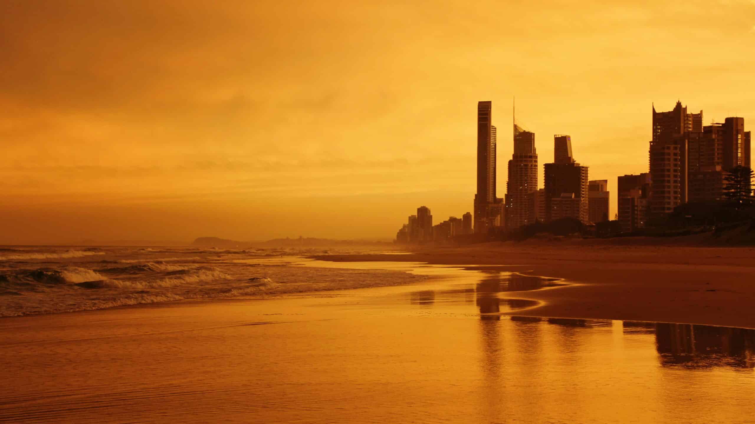 Gold Coast beach with a city skyline and water